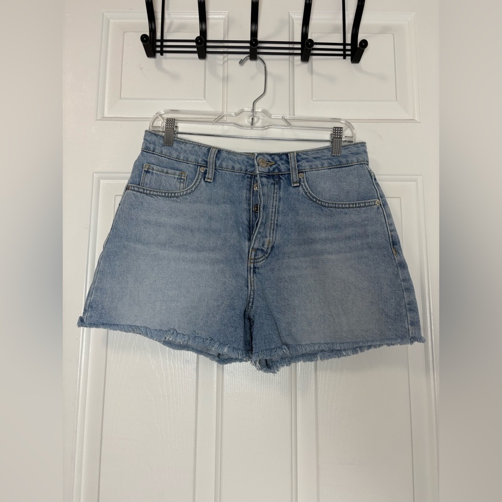Forever 21 light wash denim shorts featuring a frayed hem classic five-pocket